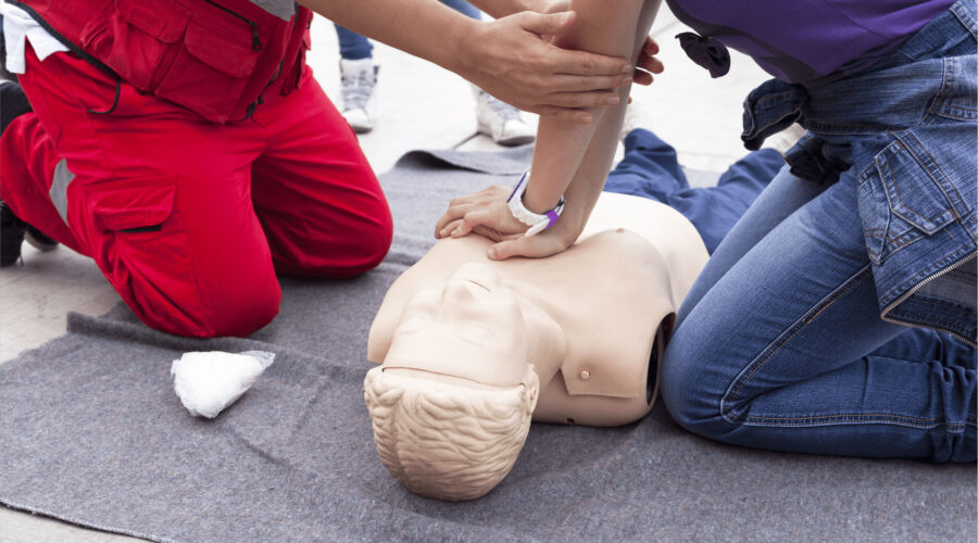 Emergency Workers performing First Aid on dummy